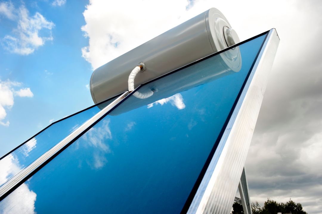 Renewable energy-powered solar hot water installation on a roof in the Whitsundays, demonstrating commitment to green building standards and enhancing household energy efficiency in harmony with the natural environment