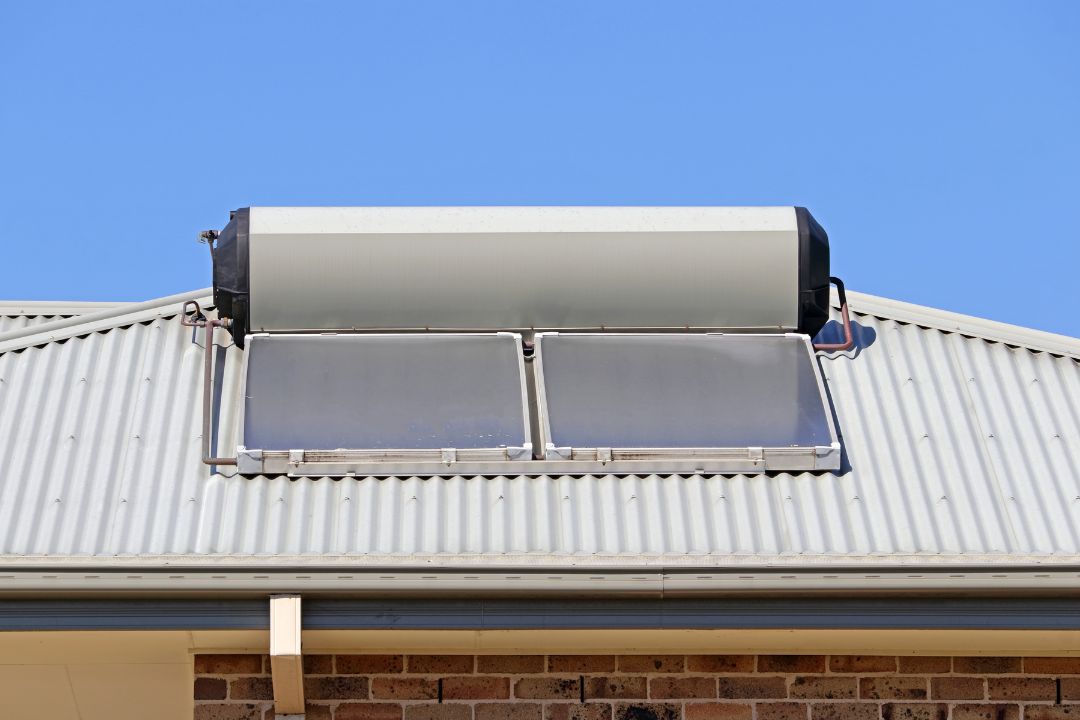 Renewable solar hot water setup gleaming on a Shute Harbour rooftop, engineered for maximum energy efficiency and tailored to thrive in local weather conditions